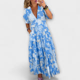 Catrisa - Vestido com padrão floral e decote em V com bolsos