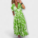 Catrisa - Vestido com padrão floral e decote em V com bolsos
