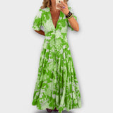 Catrisa - Vestido com padrão floral e decote em V com bolsos