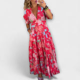 Catrisa - Vestido com padrão floral e decote em V com bolsos