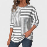 Emília - Blusa riscada de material respirável