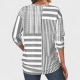 Emília - Blusa riscada de material respirável